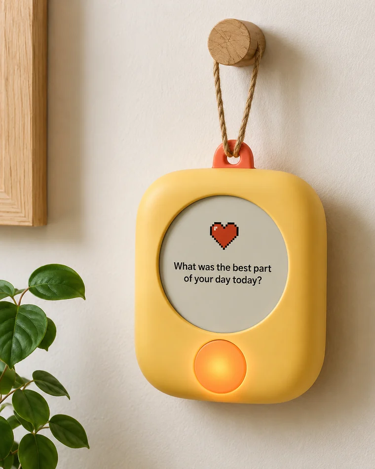 Warm conversation device hanging on a wall hook, screen asking, what was the best part of your day today